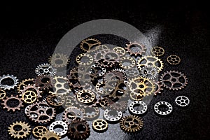 A lot of gears steampunk style symbol mechanism watch clock parts sunlight brown background