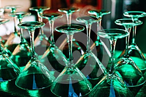 A lot of glass goblets against a dark background