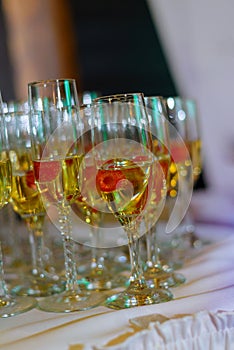 Glasses of white sparkling wine on the table