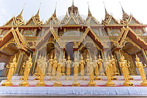 A Lot of Golden Statue standing in the temple