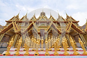 A Lot of Golden Statue standing in the temple