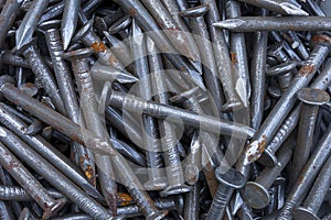 A lot of hobnail, nails with a touch of rust. Abstract background