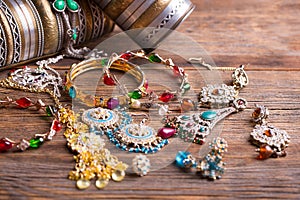 A lot of jewelry on a wooden table