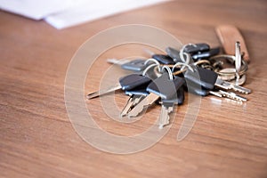 A lot of keys in chain on wooden desk office