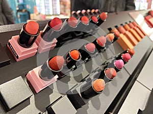 Lot of lip stick testers in make up in superstore