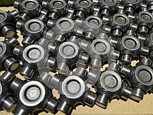 lot of mechanical components of a steering swivel, assembly line, spare parts, automotive sector, metal cross heads