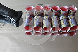 Reflection Lot of money twisters optical ilusion hairdryer metalic gray background photo
