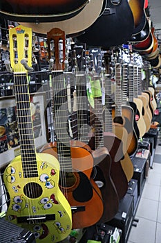 Ukulele and guitars in a musical instrument store