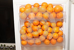 A lot of oranges in the fridge - benefits of oranges concept