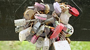 A lot of padlocks on the bridge. Autumn daytime. Smooth dolly shot