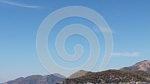 A lot of parachutists in the sky. Oludeniz paragliding.