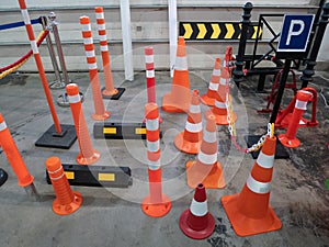 Lot of parking traffic cones and limiting driving speed barriers at hardware store