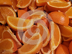 lot of pieces of orange fruit, background and texture
