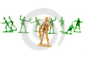lot of plastic toy soldiers on white background