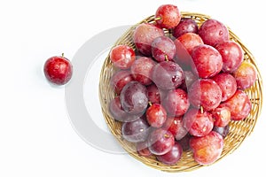 A lot of plums closeup on a white background