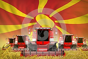 A lot of red farming combine harvesters on rural field with Macedonia flag background - front view, stop starving concept -