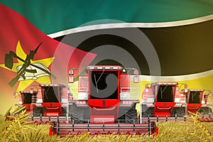 A lot of red farming combine harvesters on rye field with Mozambique flag background - front view, stop starving concept -