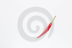 A lot of red hot chili peppers on a white background. a concept hot spice for food. top view, flat lay. Concept red food