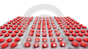 A lot of red round tablets in a packs in a row. Pharmaceuticals and pills on a white background. Space for copy