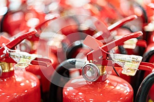 A lot red tank of fire extinguishers. protection and security concept