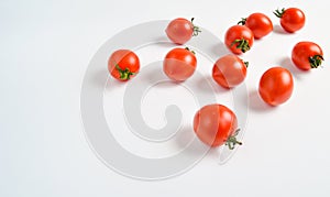 A lot of ripe mini cherry tomato on a white background.
