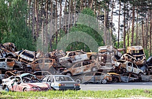 A lot of rusty burnt cars in Irpin, after being shot by the Russian military.
