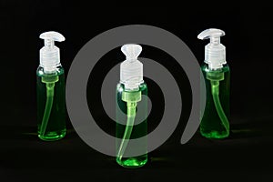 Lot of sanitizer hand antiseptics. dark background