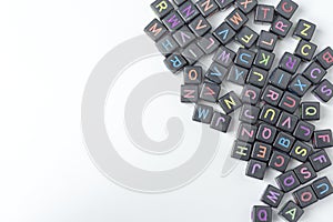 A lot of small cubes with letters on a white background.