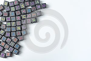 A lot of small cubes with letters on a white background.