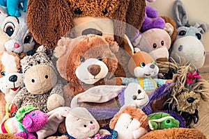 Lot of Soft plush toys sits on floor in the children`s room