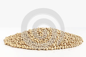 A lot of soybeans pile isolated on white background with copy space for text. Concept food for healthy. Soybean is a leguminous