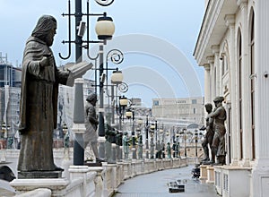Lot of statues on promenade at Cardar river in Skopje photo