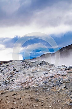 A lot of steam in a rock field, in autumn colors, ReykjahlÃ­Ã°, Iceland