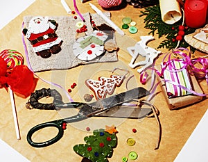 Lot of stuff for handmade gifts, scissors, ribbon, paper with co