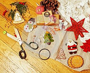 Lot of stuff for handmade gifts, scissors, ribbon, paper with co