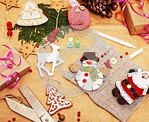 Lot of stuff for handmade gifts, scissors, ribbon, paper with countryside pattern, ready for holiday concept, nobody