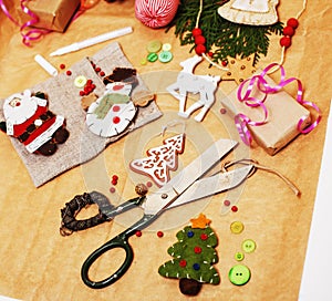 Lot of stuff for handmade gifts, scissors, ribbon, paper with countryside pattern, ready for holiday concept, nobody