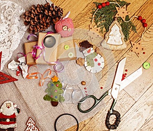 Lot of stuff for handmade gifts, scissors, ribbon, paper with countryside pattern, ready for holiday concept, nobody
