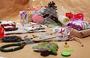 Lot of stuff for handmade gifts, scissors, ribbon, paper with countryside pattern, ready for holiday concept, nobody