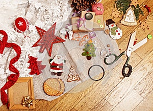 Lot of stuff for handmade gifts, scissors, ribbon, paper with countryside pattern, ready for holiday concept, nobody