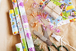 Lot of stuff for handmade gifts, scissors, ribbon, paper with countryside pattern, ready for holiday concept, nobody