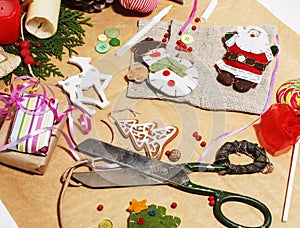 Lot of stuff for handmade gifts, scissors, ribbon, paper with countryside pattern, ready for holiday concept, nobody