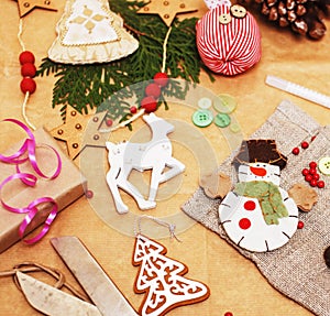 Lot of stuff for handmade gifts, scissors, ribbon, paper with countryside pattern, ready for holiday concept, nobody