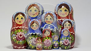 Lot of traditional Russian matryoshka dolls on white background