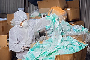 A lot of used face mask not well managed, biohazard garbage medical contaminate trash very dangerous photo