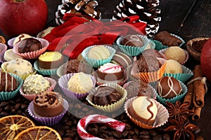 a lot of variety chocolate pralines, belgian confectionery gourmet chocolate and christmas spices with apples
