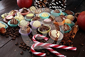 a lot of variety chocolate pralines, belgian confectionery gourmet chocolate and christmas spices with apples
