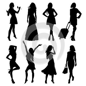 A lot of vector black silhouettes of beautiful women on white background