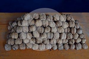 A lot of walnuts folded in the form of a prism