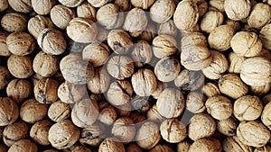 Inshell walnuts as background